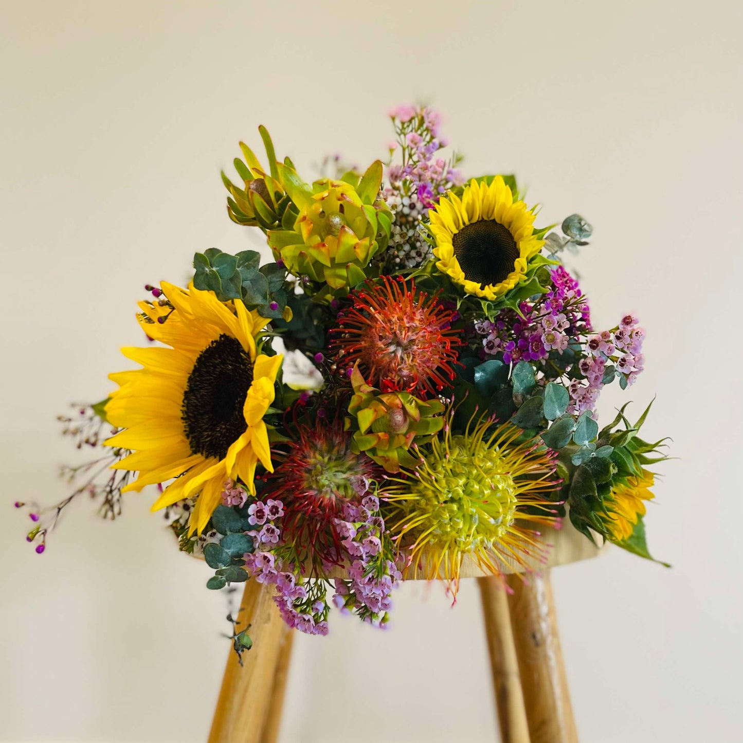 Sunflower and native Australian wildflower bouquet with vibrant blooms, available for local delivery from Elanora Flower House, perfect for celebrations and gifts.